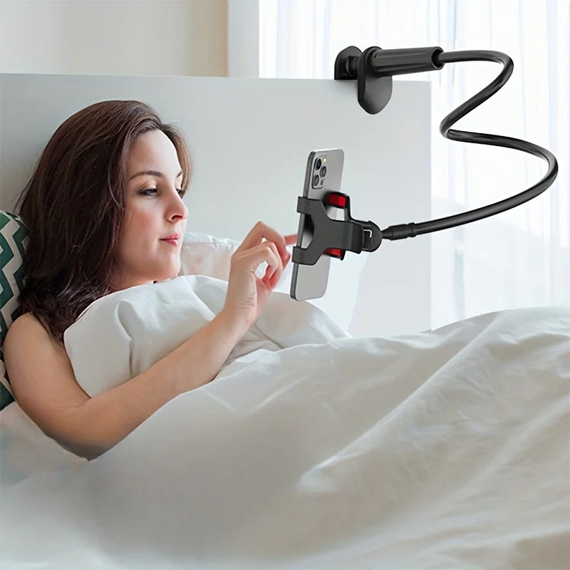 Black gooseneck phone holder clamped to bed headboard in use by person lying down