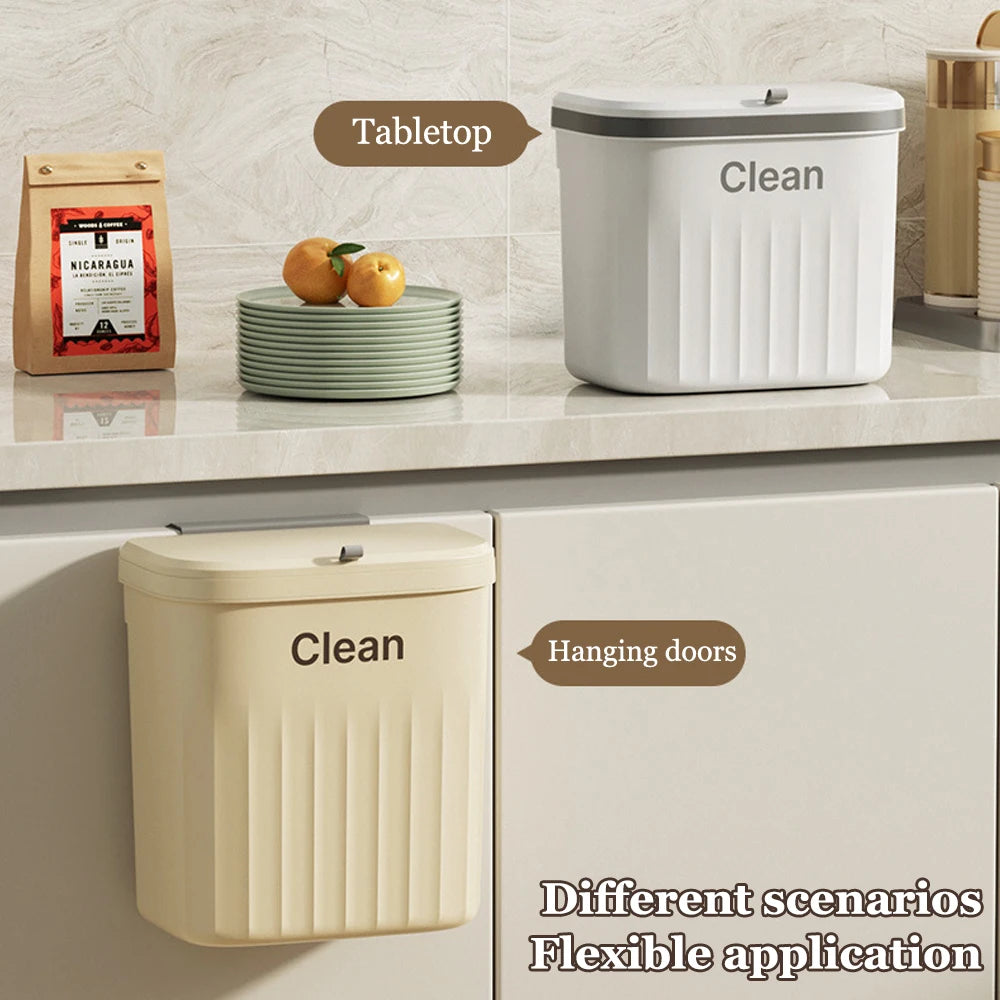 Beige and white hanging trash cans used on a cabinet door and placed on a countertop, labeled for tabletop or hanging use