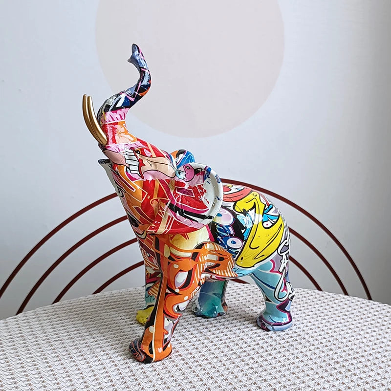 Side view of colorful resin elephant decor piece on a white surface