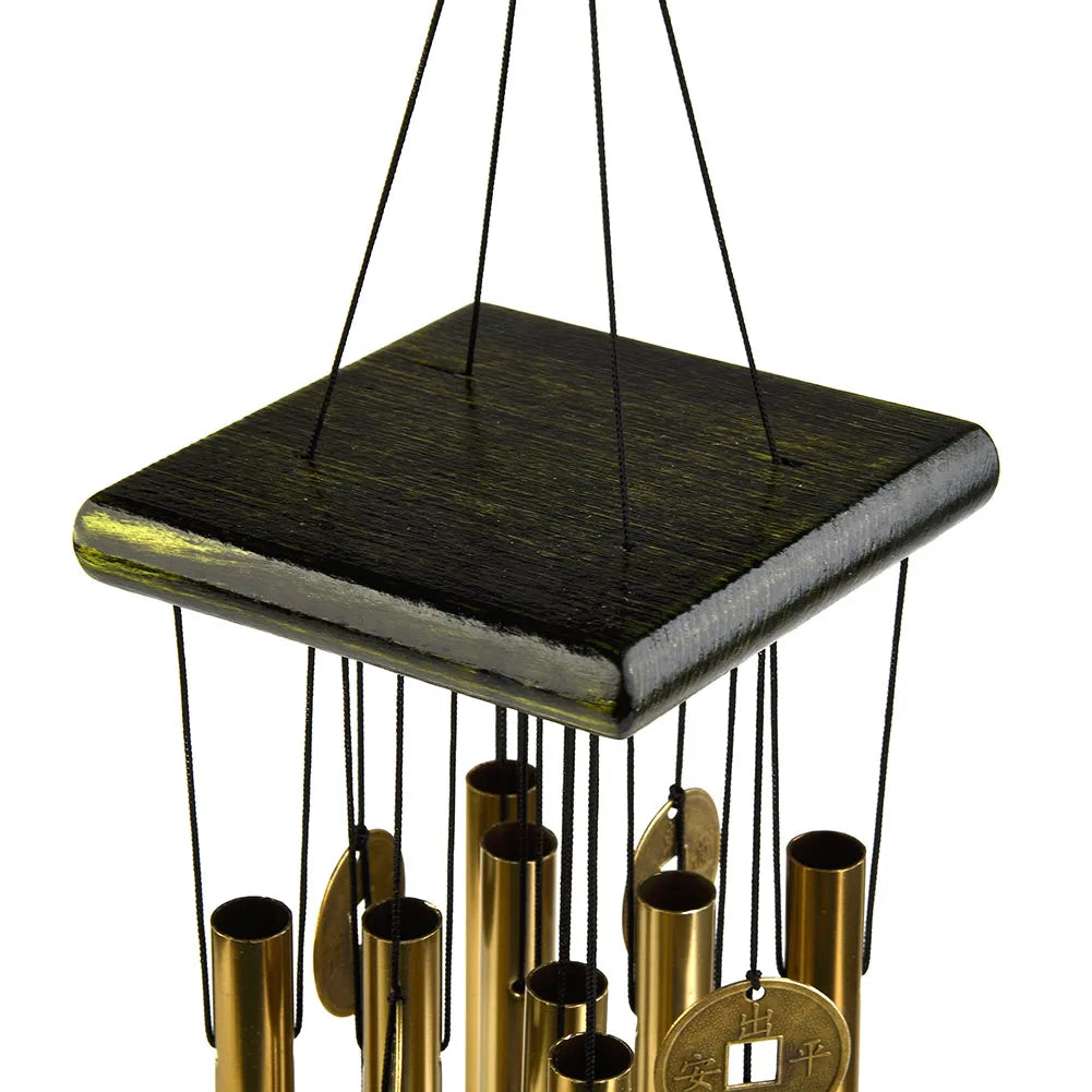 Close-up of the square wooden top of the wind chime with black cords