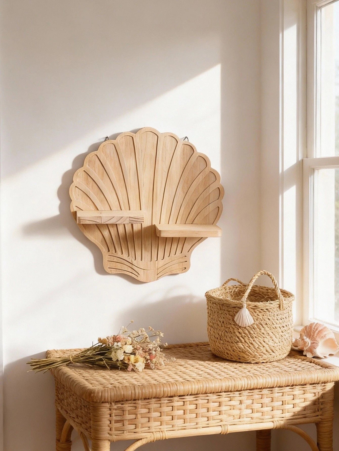 Wide view of the seashell wall shelf above a woven bench, styled with soft neutral decor for a cozy, airy bedroom or living room feel.