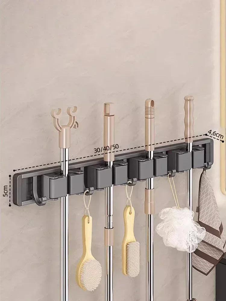 Organizer rack with four cleaning tools and accessories, wall-mounted, showing labeled dimensions