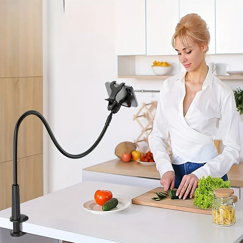 Flexible black phone holder clamped to kitchen counter for hands-free video viewing