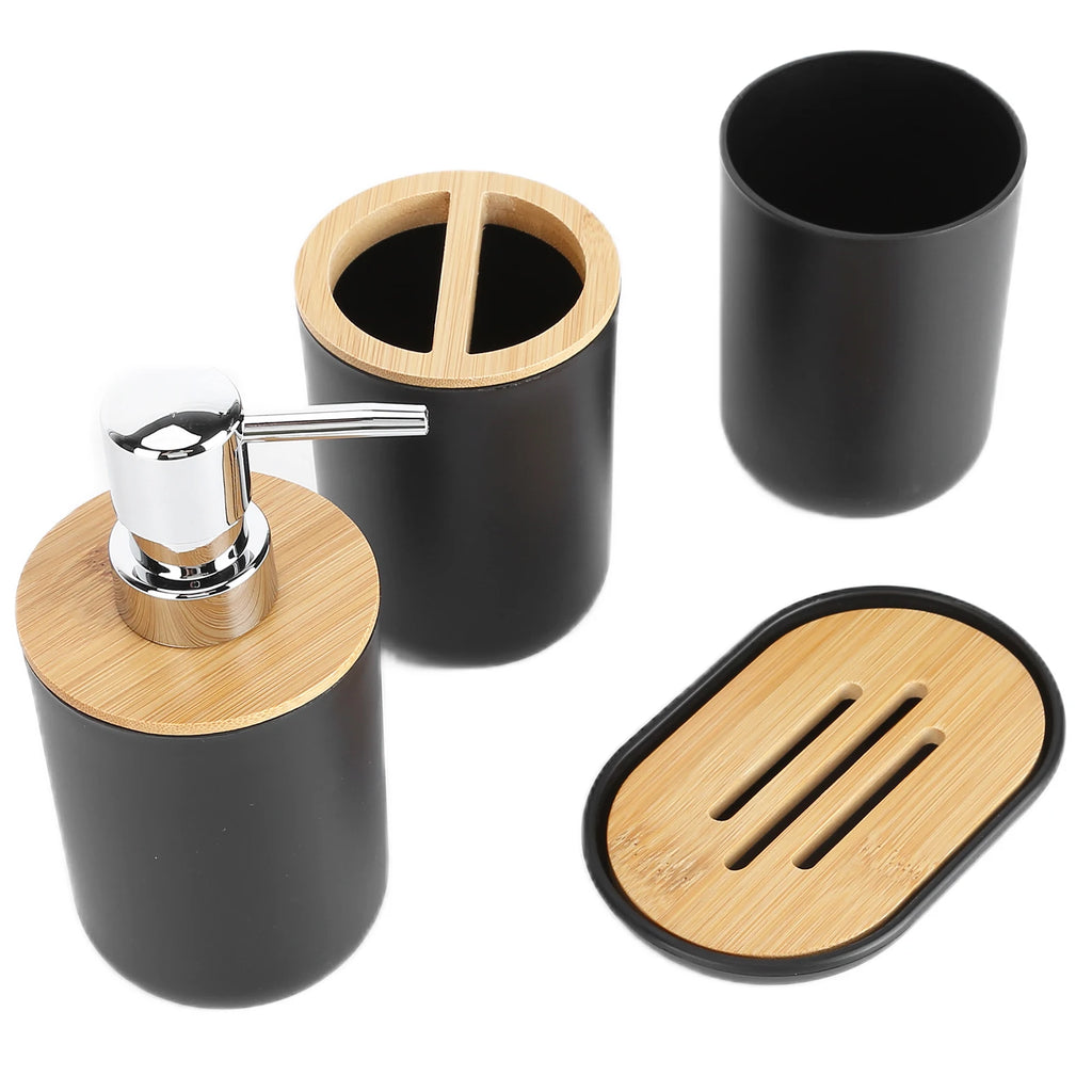 Detail view of black bathroom accessory set showing soap dispenser, divided toothbrush holder, tumbler, and soap dish with bamboo tops