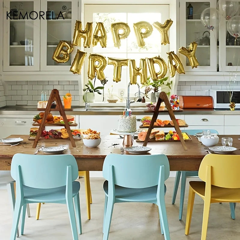 birthday kitchen party setup with two wooden tiered tray stands holding various treats