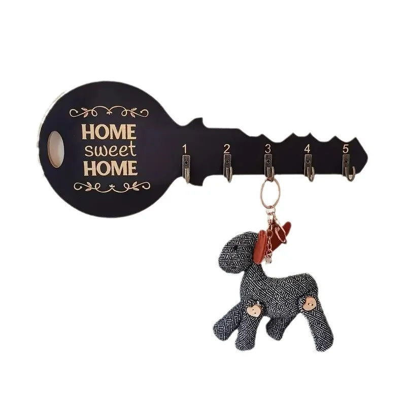 Black wood wall-mounted key rack in the shape of a key with five numbered hooks