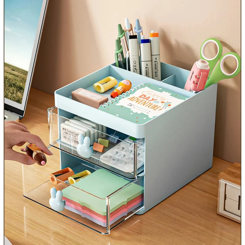 Blue desk organizer with open drawers showing pens, sticky notes, and stationery