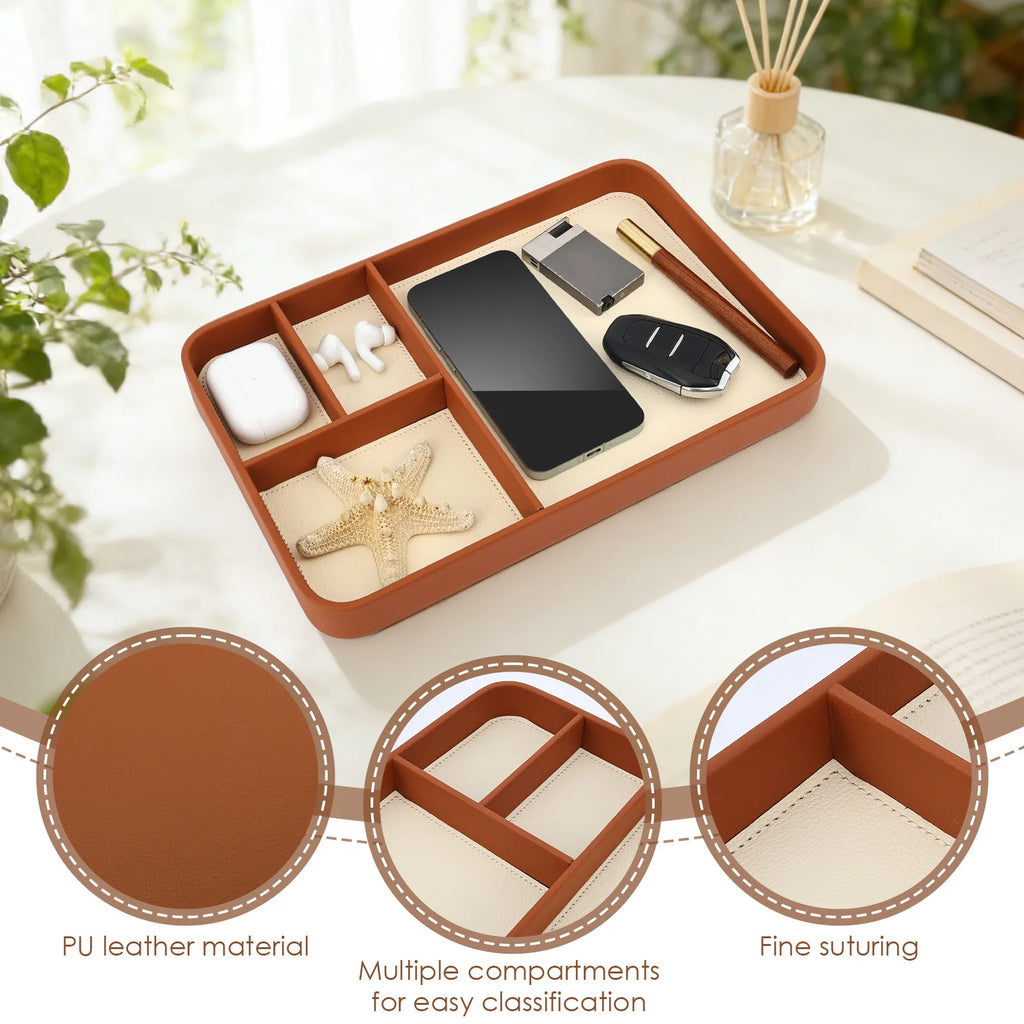 PU leather storage tray with four compartments on a bright tabletop with plants