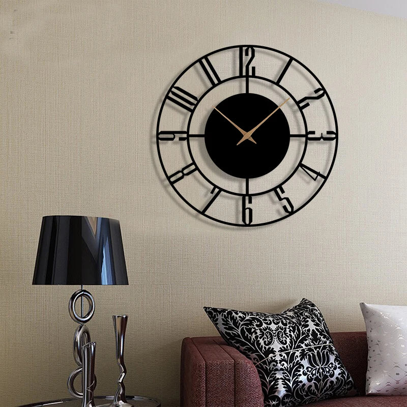 Minimalist black wall clock mounted above a sofa and lamp in a cozy living room