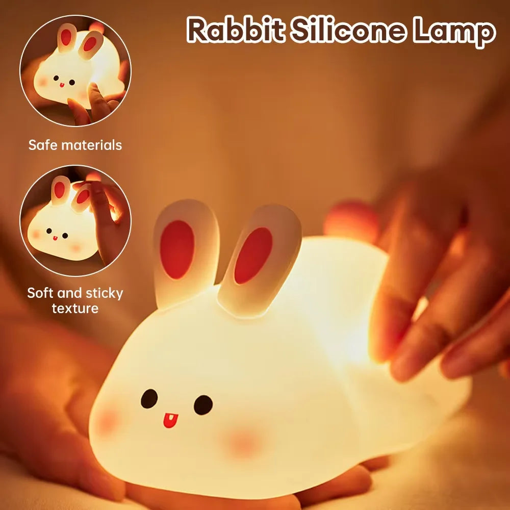 Hands holding a soft bunny-shaped silicone night light, highlighting texture and safety