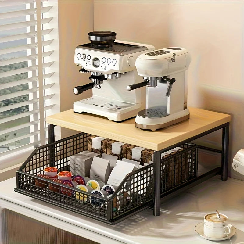 Kitchen counter coffee organizer station with wooden top shelf holding two coffee machines and a metal pull-out basket below storing coffee pods and supplies