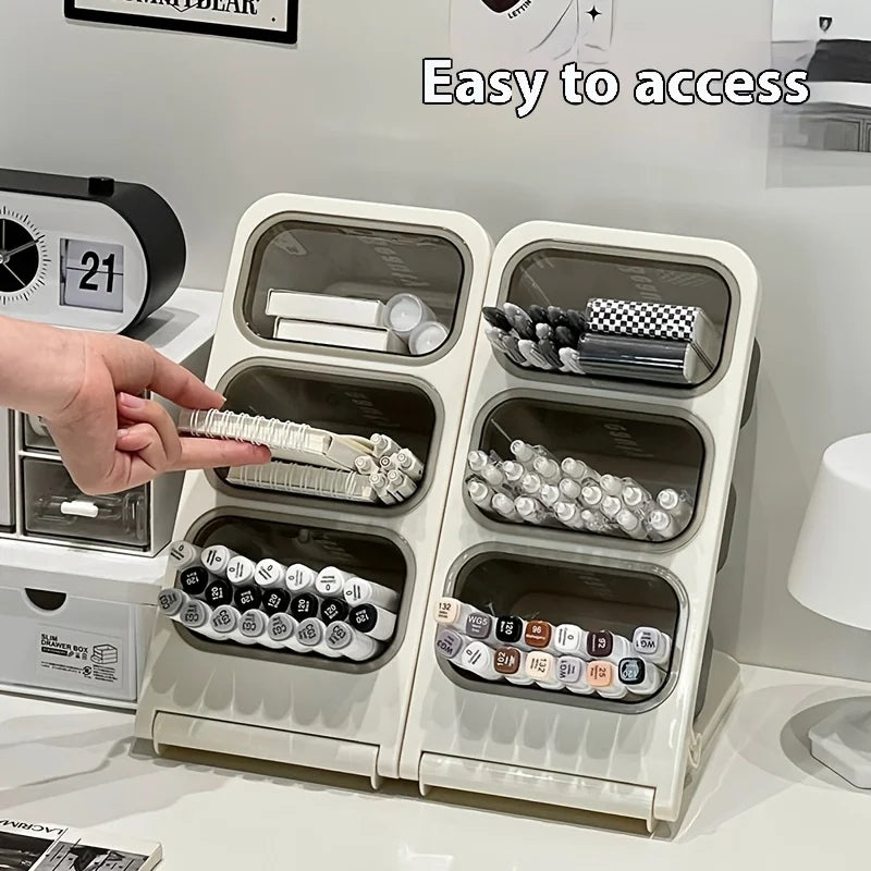 hand reaching for markers in angled desk organizer with three open bins
