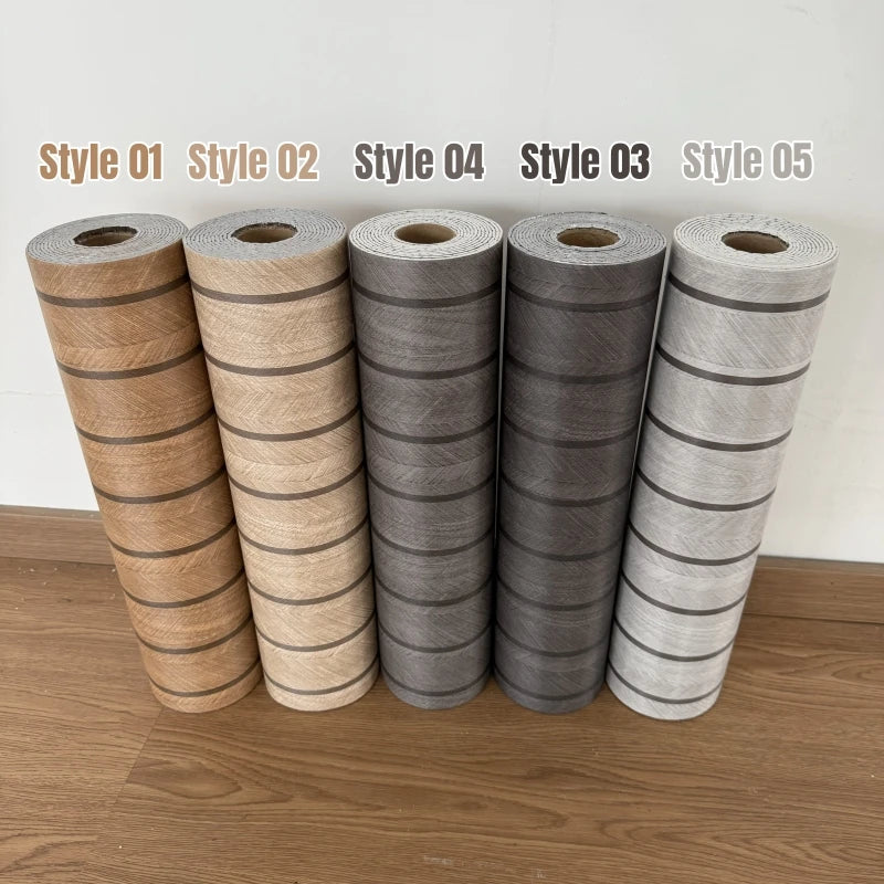 Assorted wood grain slat wall panel rolls in five colors labeled by style