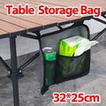 Hanging table storage bag clipped to a folding table holding a can and napkins