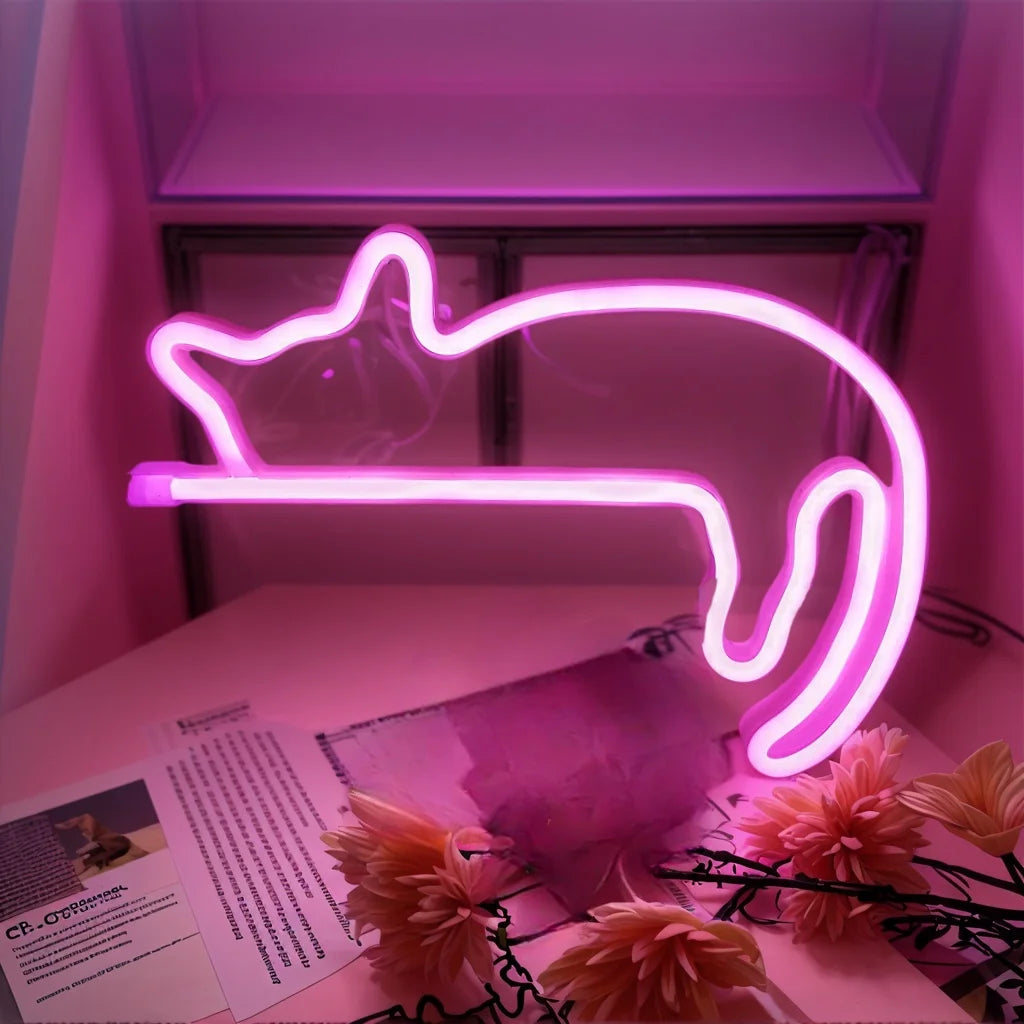 Pink cat outline neon LED wall light glowing in a cozy space