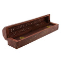 Hand-carved wooden incense holder box open, showing brass holders inside