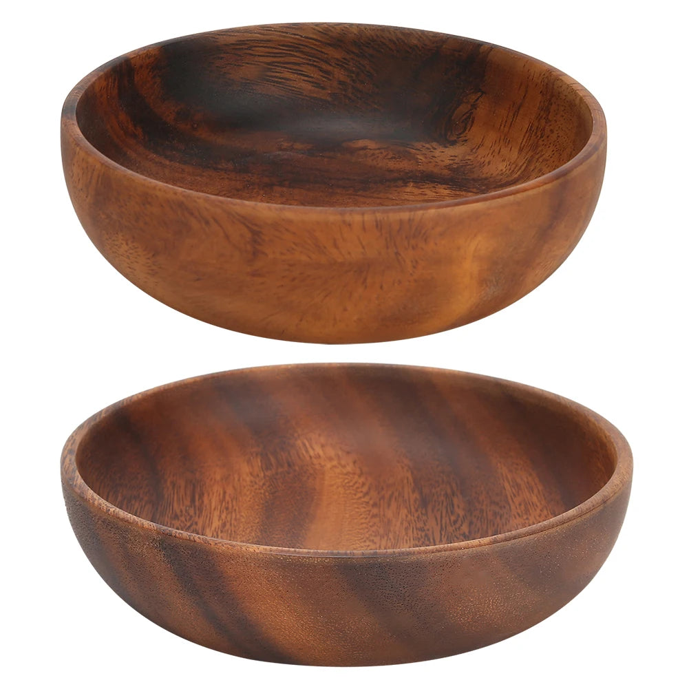 Two round wooden serving bowls with natural grain, empty on white background