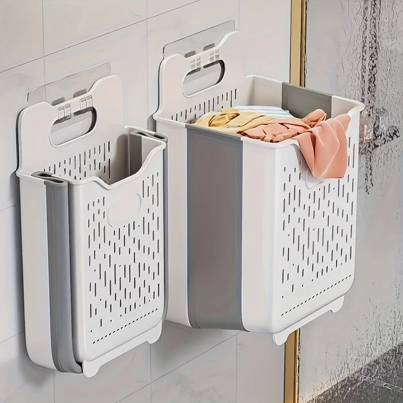 Two wall-mounted laundry hampers side by side fixed to tiled bathroom wall