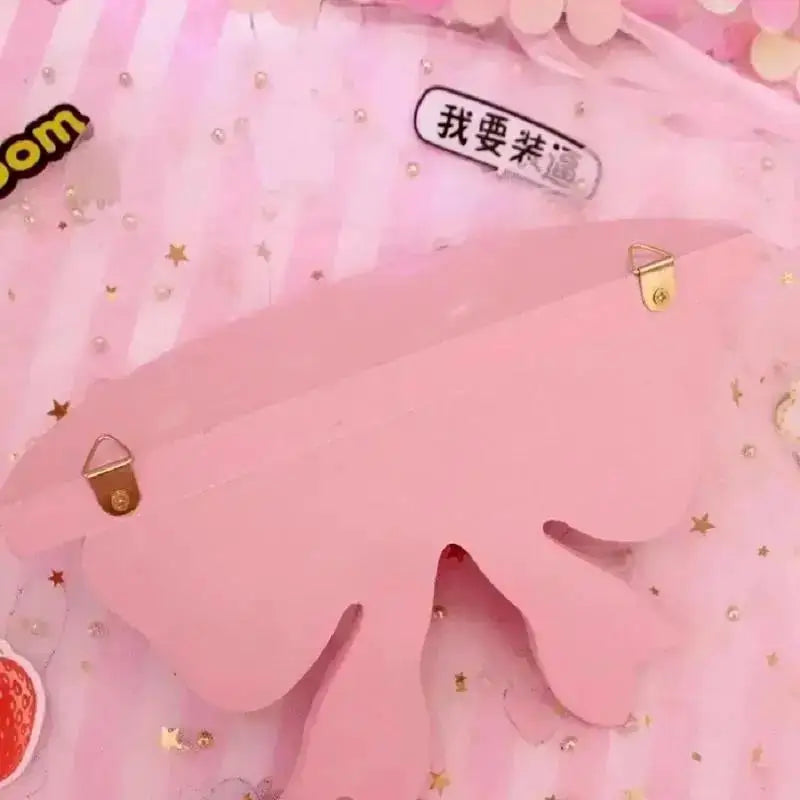 Back view of a pink bow wall shelf showing hanging hardware