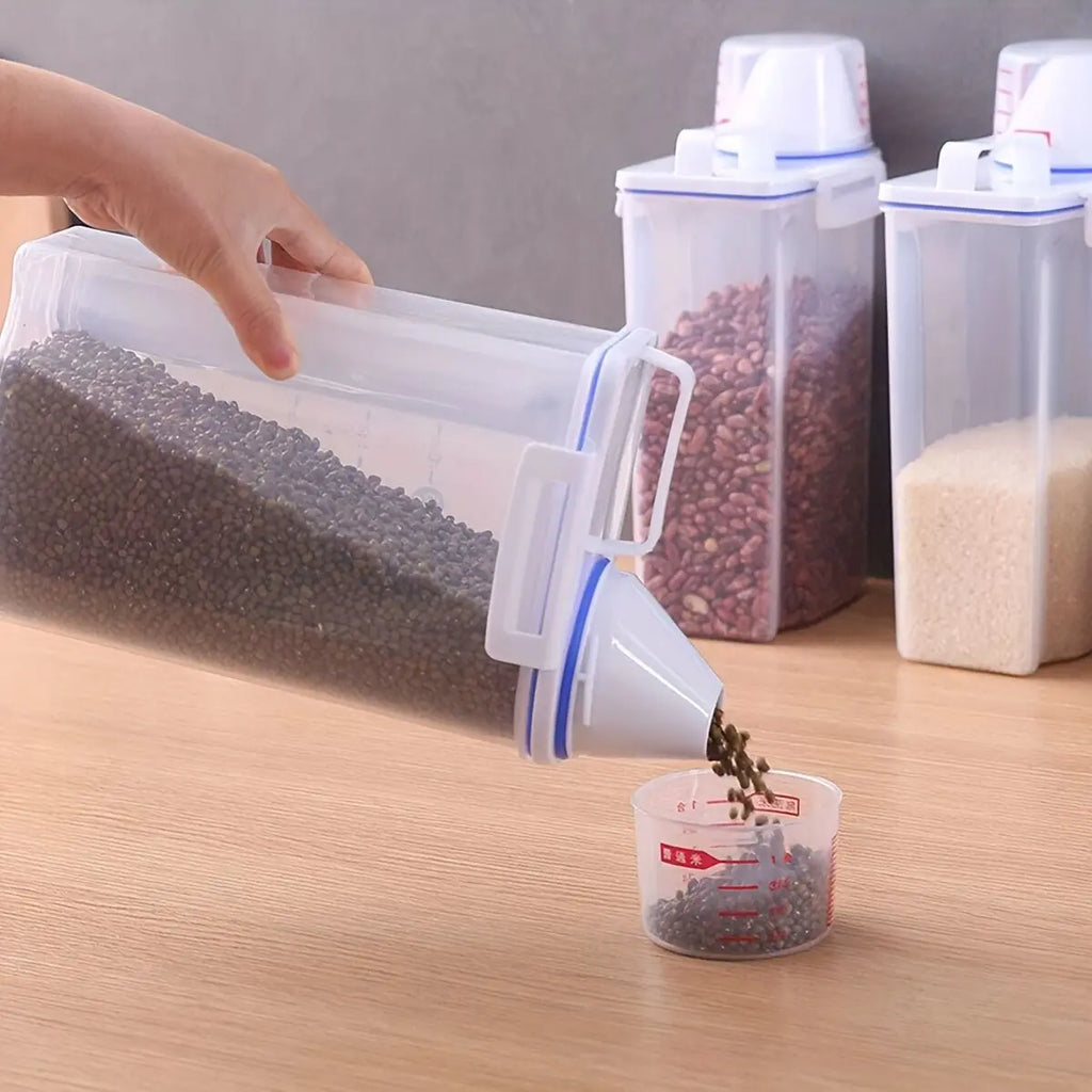 Clear food storage bin dispensing dry beans, fits neatly on a kitchen counter