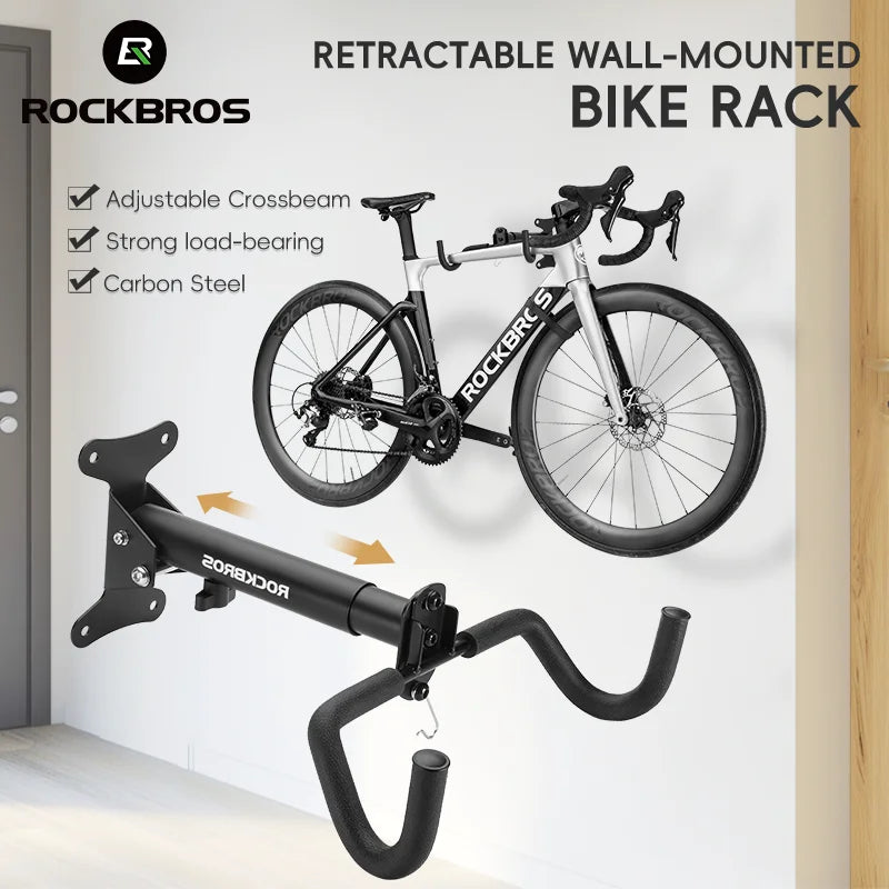 Folding wall-mounted bike rack with adjustable arm holding a bike on a wall in a modern home entryway