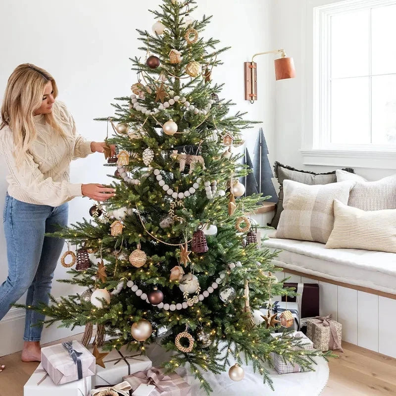 Living room featuring decorated Christmas tree with neutral-toned ornaments