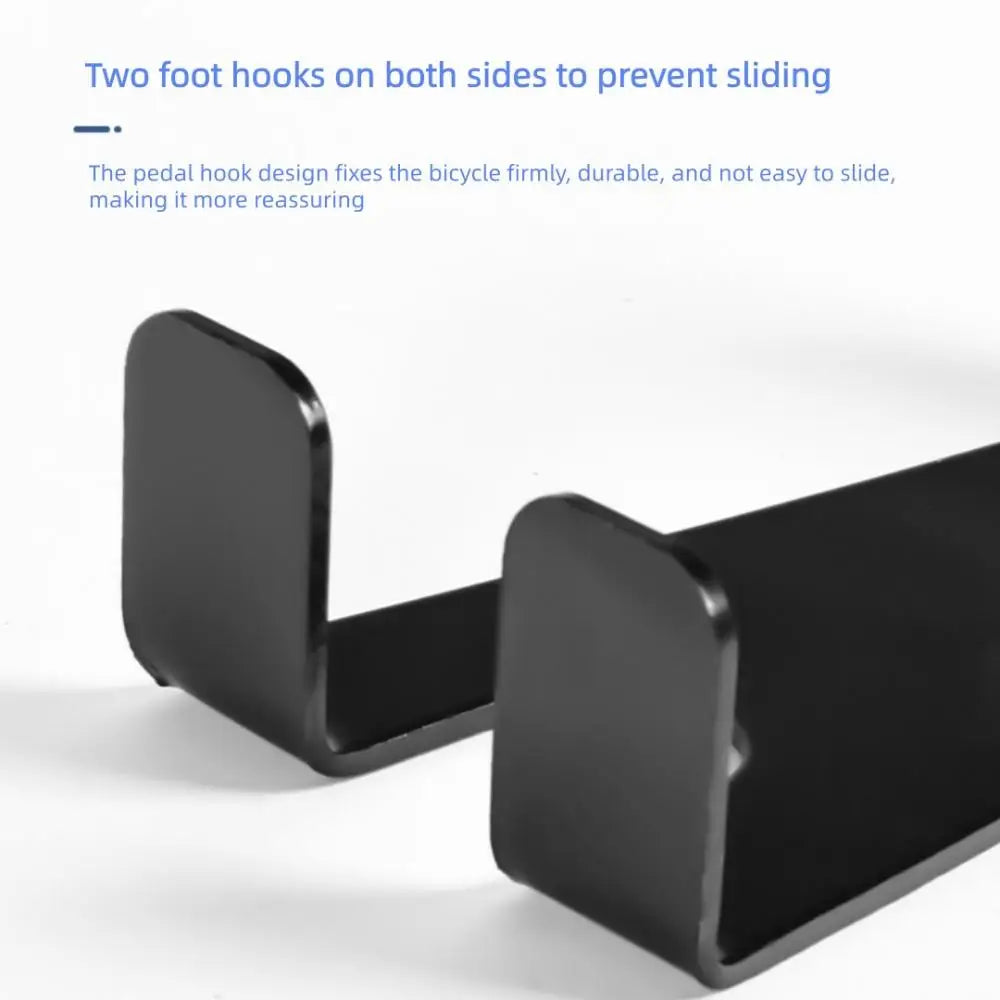 Close-up of pedal hook design on black steel bike wall mount