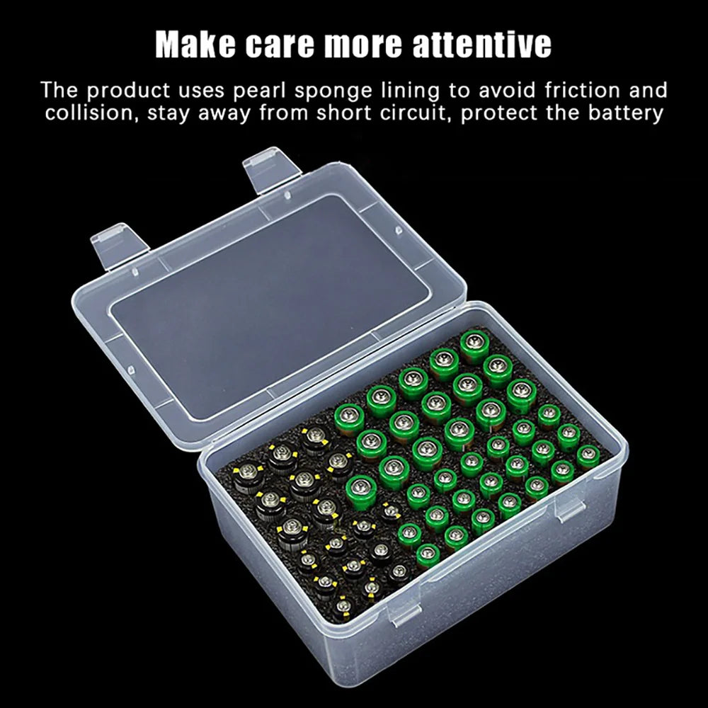 Transparent battery organizer box with foam lining holding green and black AA and AAA batteries, black background