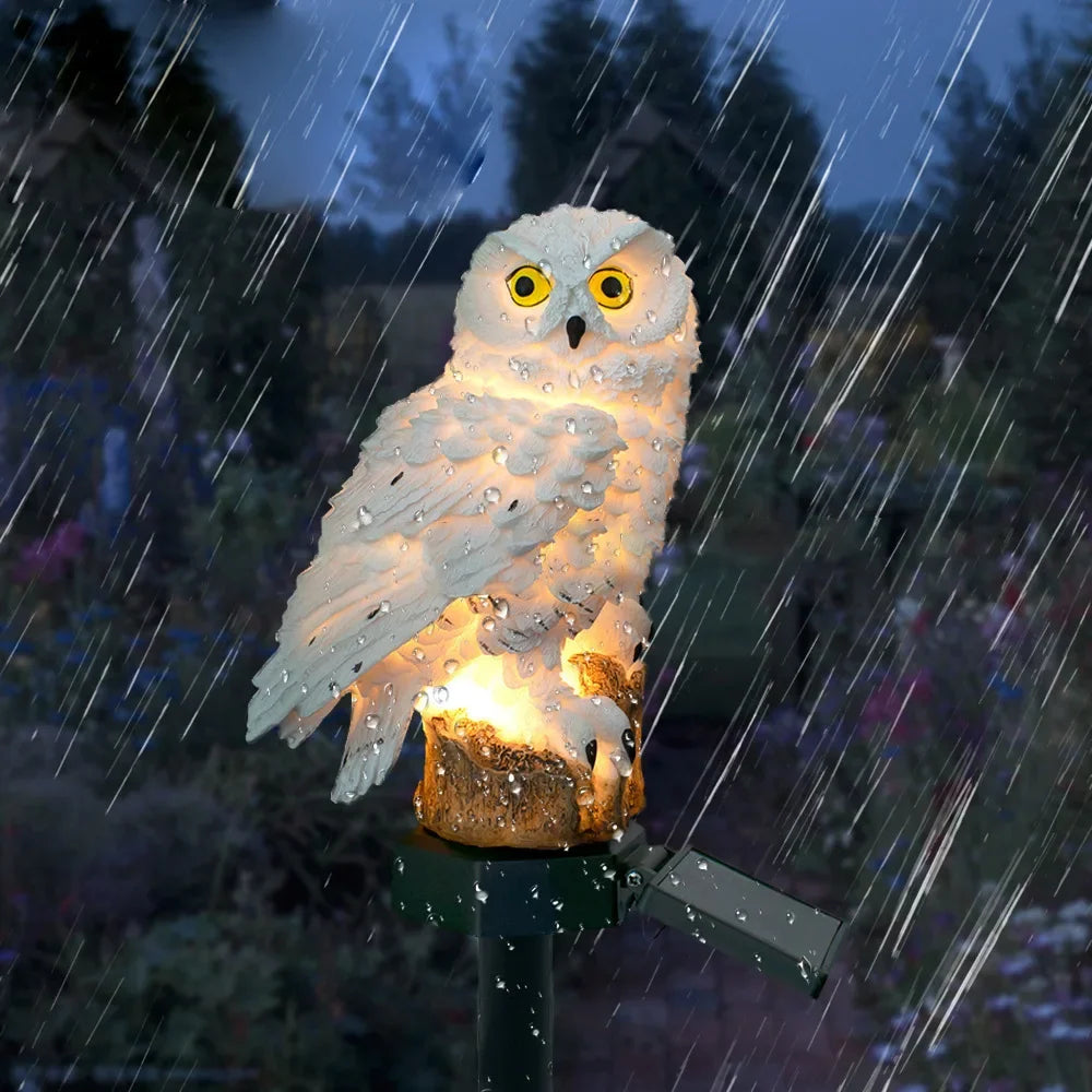 White owl solar light in a rainy garden setting to show water resistance