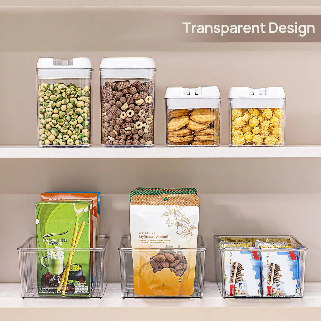 Clear organizer bins sorting snack packets on pantry shelves under clear food containers