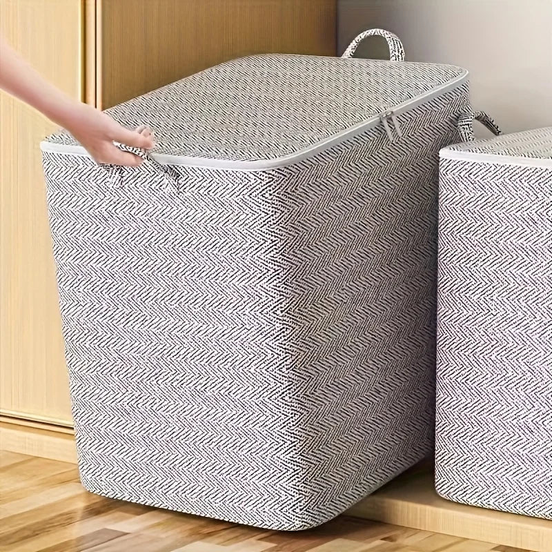 Extra large lidded fabric storage box in modern herringbone pattern being lifted by handle near a closet
