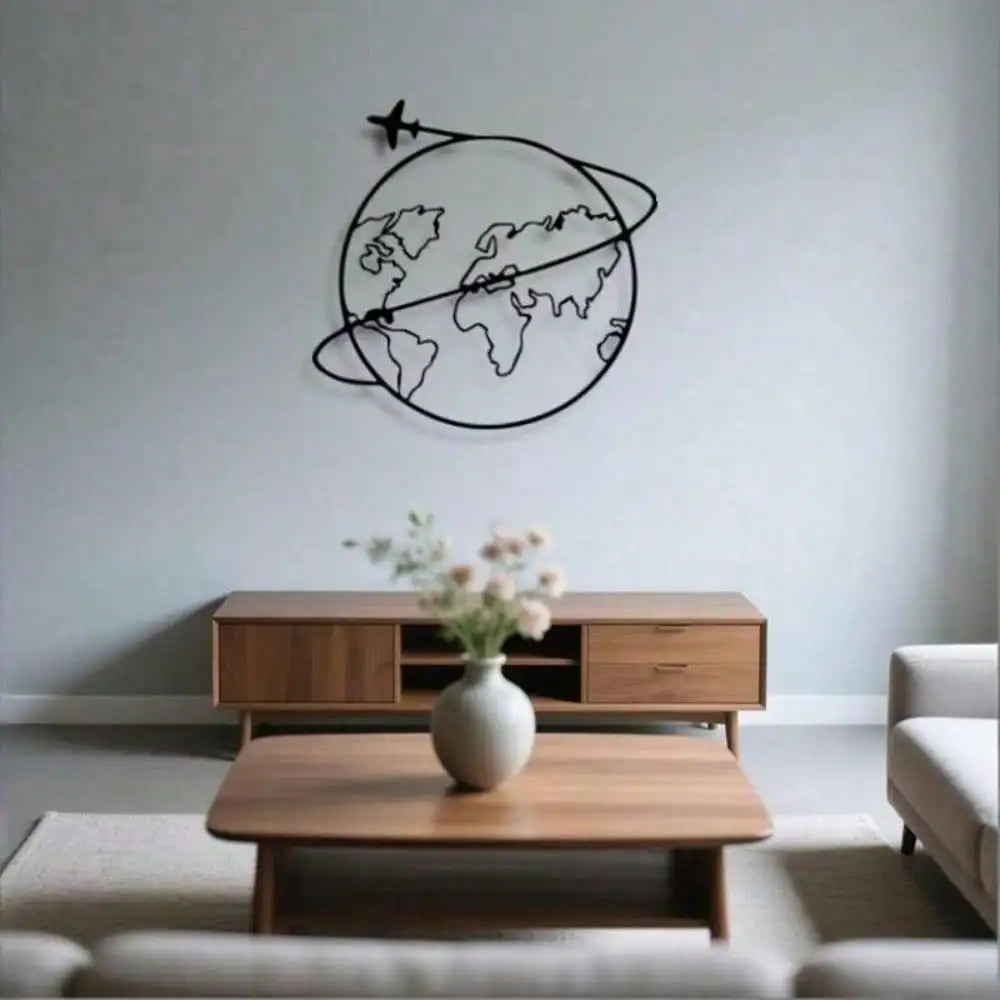 Black wire outline world map wall art with airplane over mid-century style coffee table