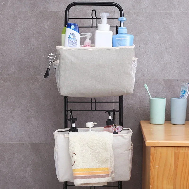 Hanging bedside caddy in beige on a metal bathroom rack, organizing bottles and toiletries