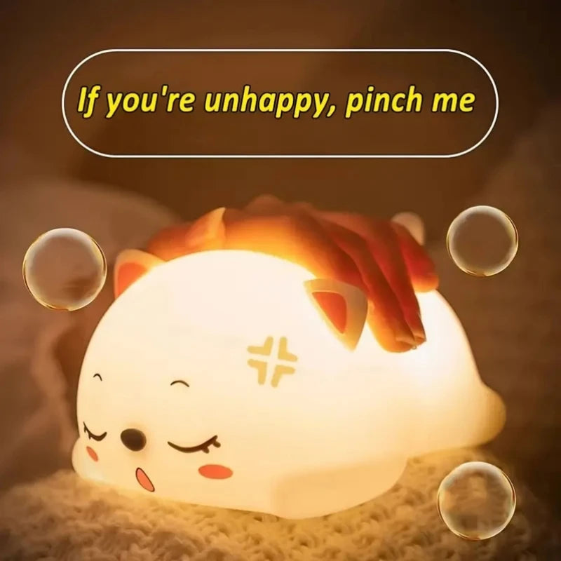 soft silicone cat night light being squeezed by hand, gentle soothing expression