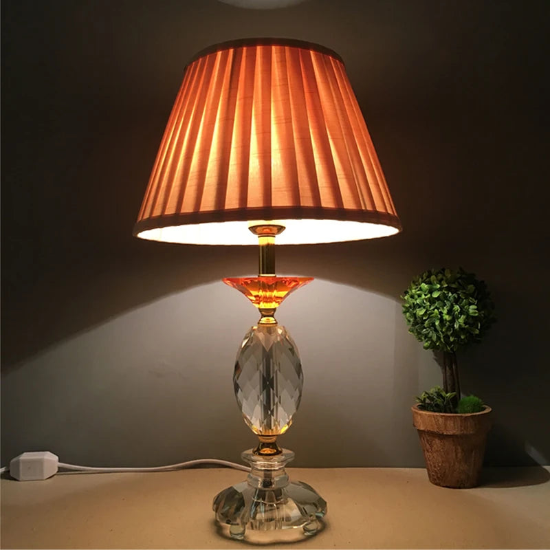 Warm-toned pleated cloth lampshade on a decorative lamp