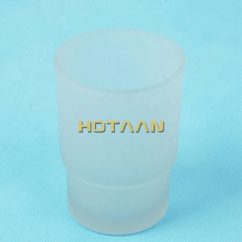 Matte glass toothbrush cup on blue background