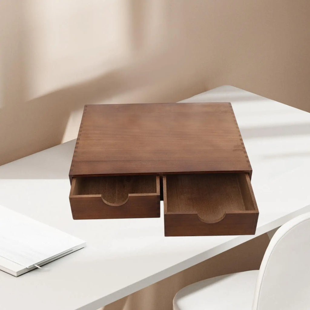 Wood coffee and tea storage organizer with drawers on a white desk