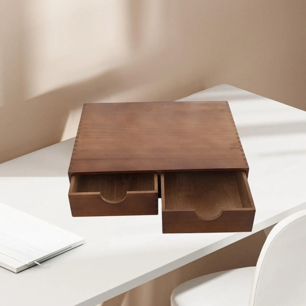 Wood coffee and tea storage organizer with drawers on a white desk