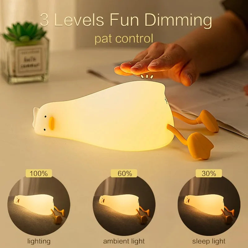 Duck silicone night light showing three dimming levels controlled by patting