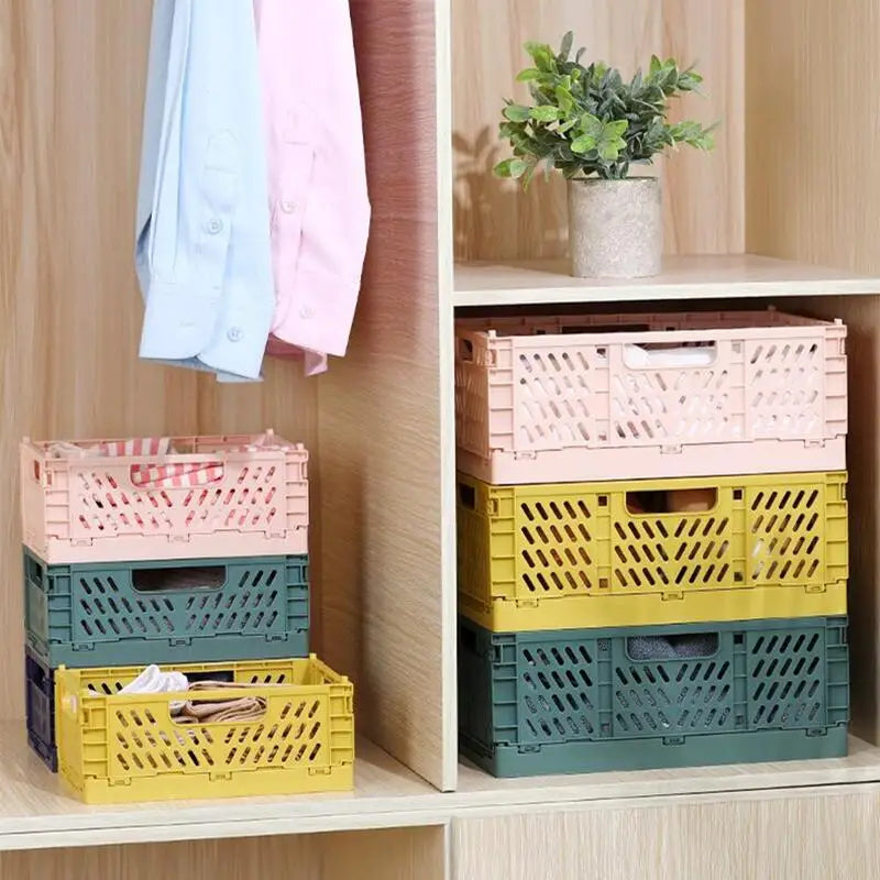 Stackable foldable plastic storage crates in pastel colors organized in a closet