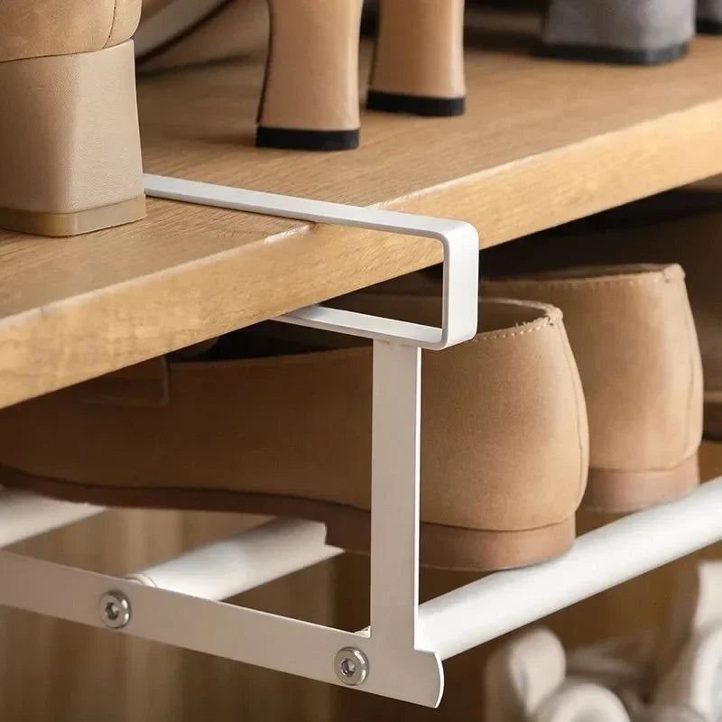 close-up of steel under-shelf rack hook fitting onto a wooden shelf