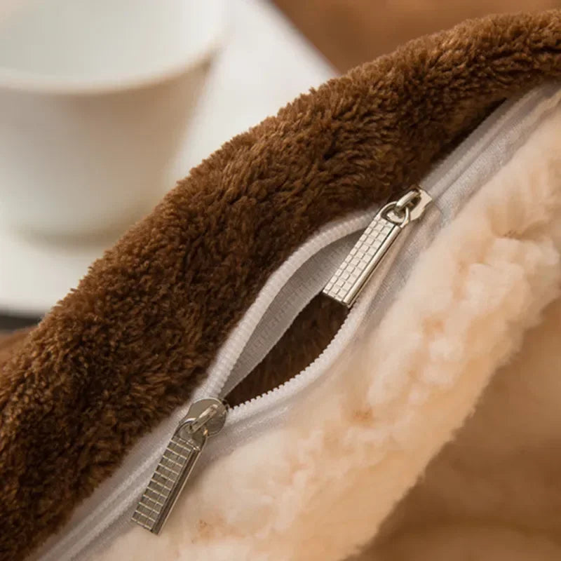 Detail of zipper closure on sherpa fleece duvet cover in coffee color