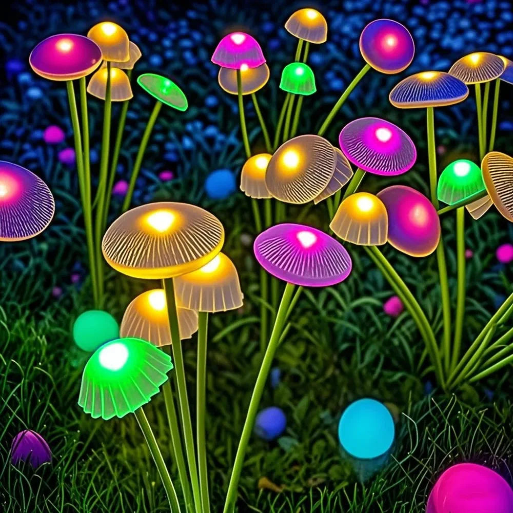 Solar mushroom garden lights with colorful LED glow in outdoor grass at night