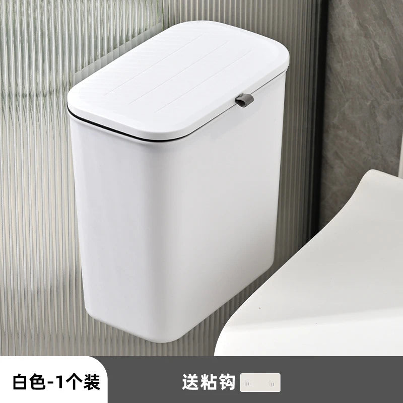 white rectangular wall-mounted trash bin with lid installed in modern bathroom