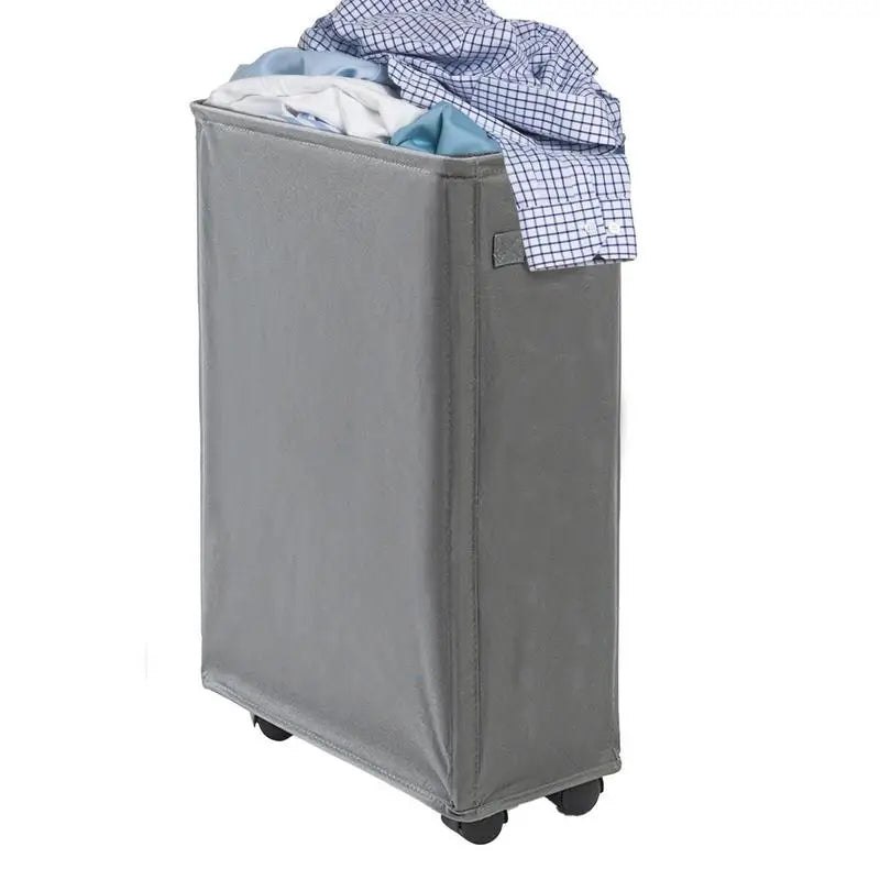 Slim gray rolling laundry hamper filled with laundry, showing wheels and handle