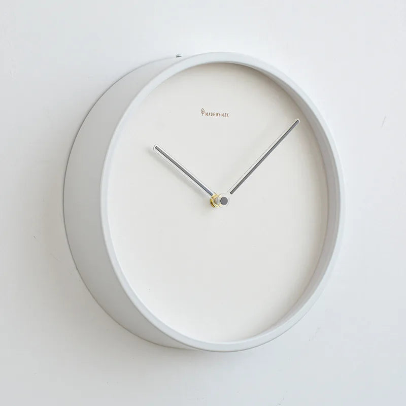 Side angle of white metal frame minimalist wall clock