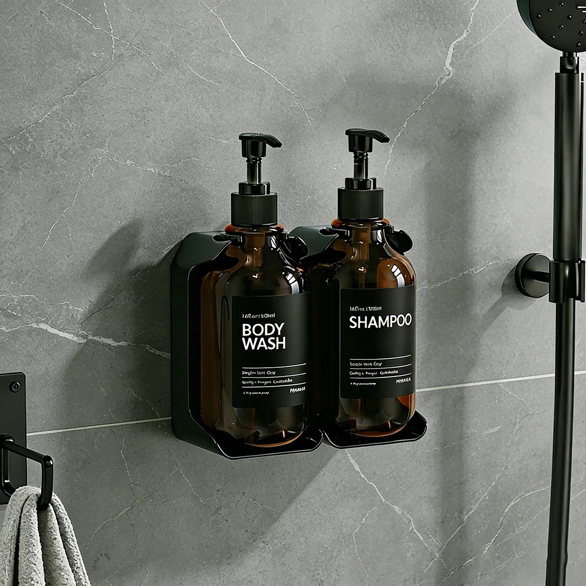 Two amber wall-mounted dispenser bottles with black pumps for body wash and shampoo on a gray bathroom wall