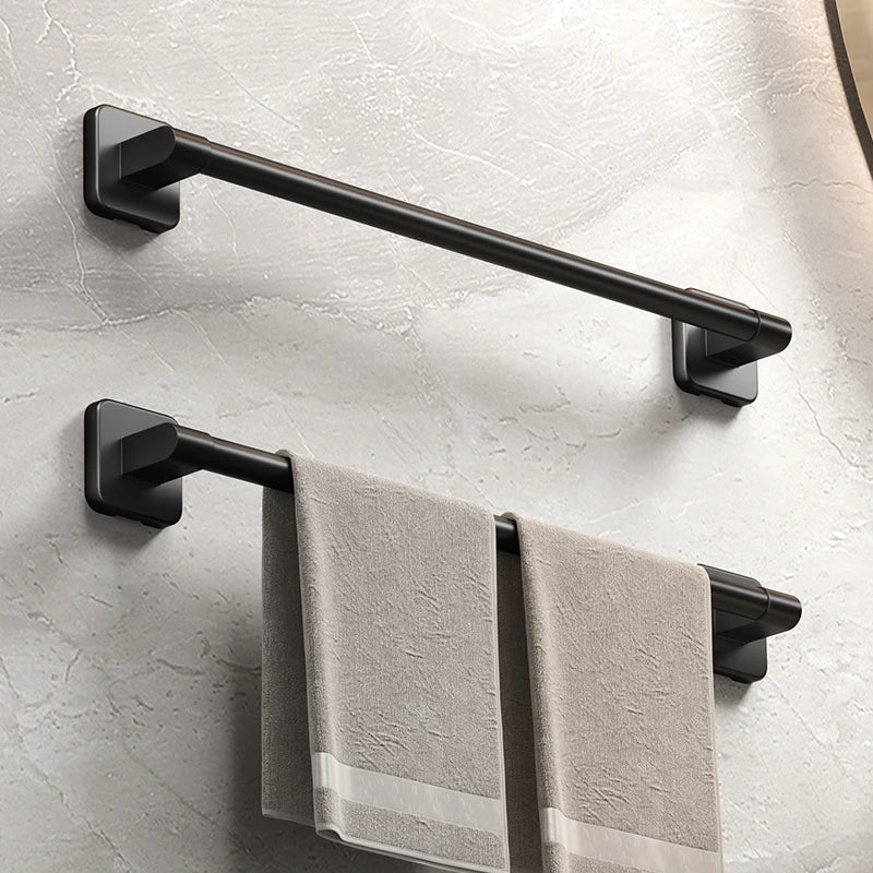 Black bathroom towel bars shown with neutral towels, styled in a modern bathroom