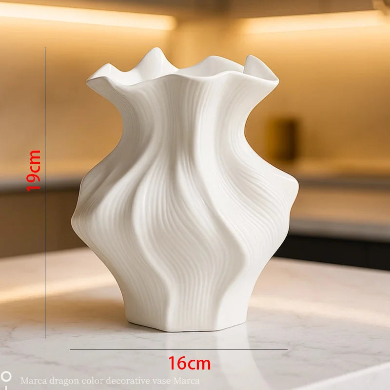 dimensioned image of white ceramic wave vase showing 19cm height and 16cm width
