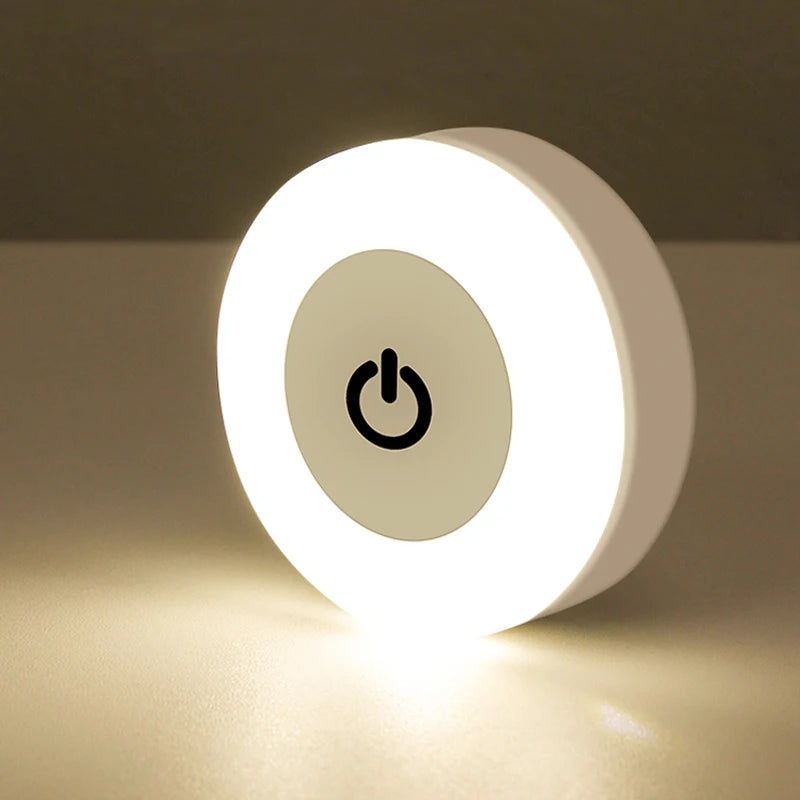 Round USB touch night light glowing on a tabletop, showing touch sensor